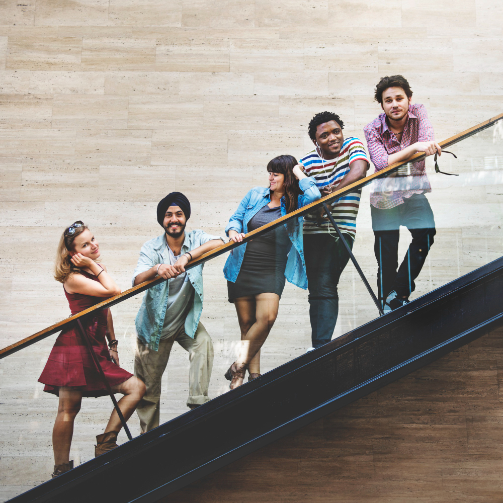 group-diversity-friends-standing-staircase